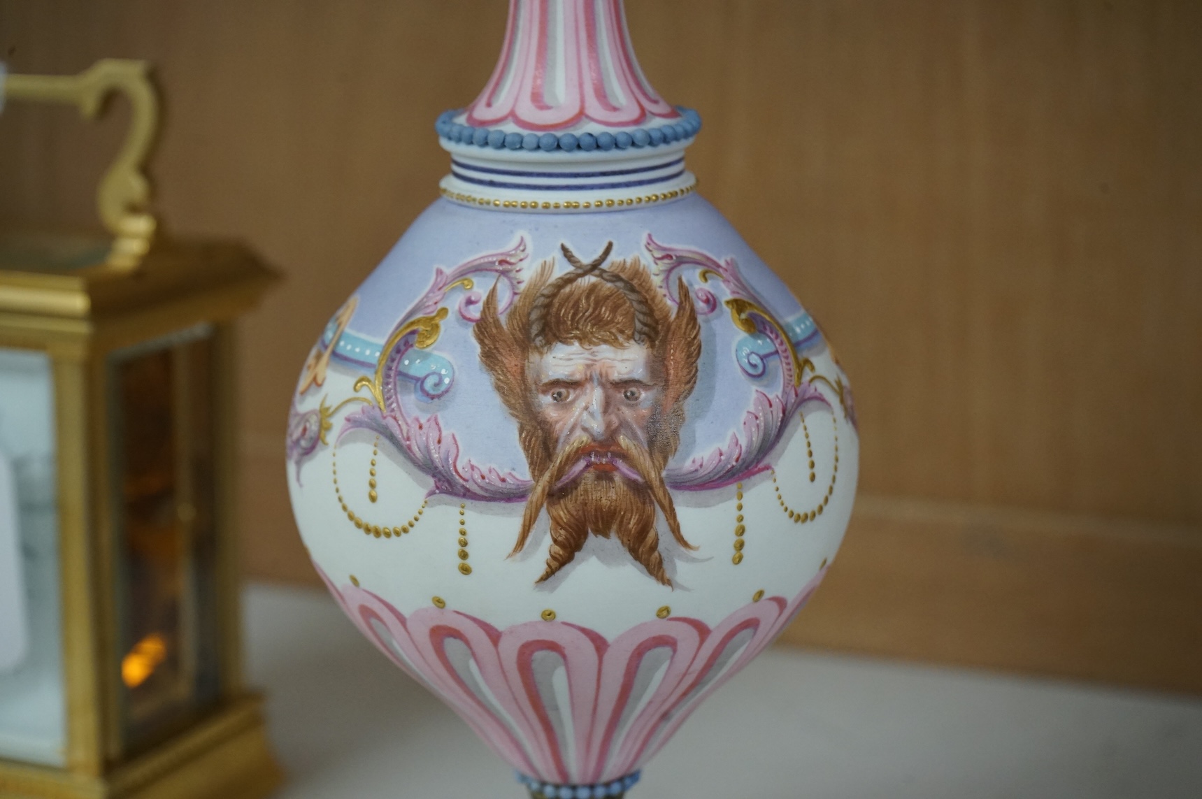 A 19th century Paris porcelain neo-classical pedestal ewer decorated with satyr mask and scrolls, 24cm high
